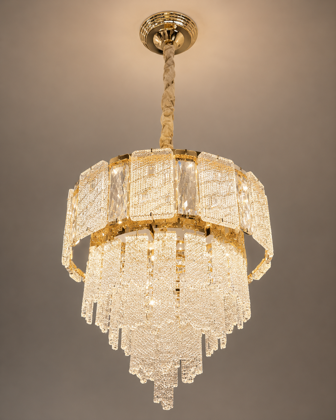 Imperial Crystal Crown Chandelier featuring a gold-finished frame with cascading crystal panels and warm luxury illumination.